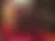 In latex and sheer black pantyhose.