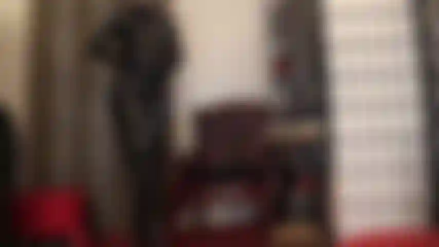 Mistress in all shiny black pvc - worship this skintight suit and tall boots.