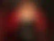 Fully dressed in shiny red and black pvc.