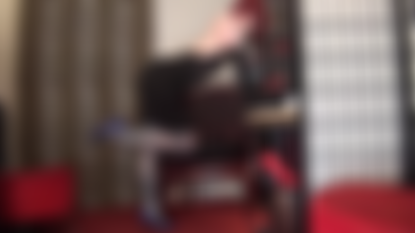 Nylon leg tease and feet in blue-gray glossy stockings and garters on shiny nude pantyhose.