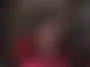 Sexy sensual tease with crossed legs in sheer black pantyhose, with dangling of steel heel pumps.