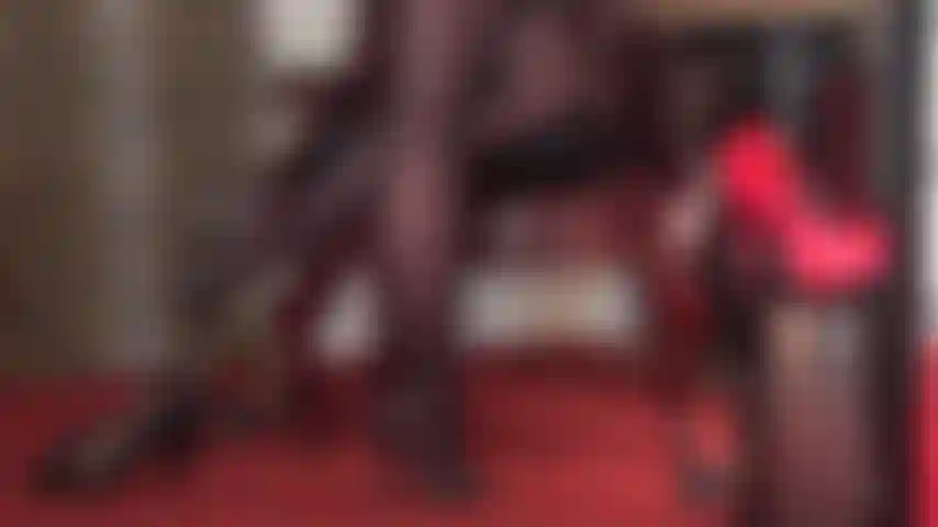 Shoe and foot worship in black high heeled leather mules.