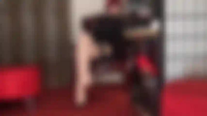 Sensual tease with long legs and sexy feet in ivory seamed cuban stockings and garters.