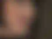 Black wig, red lipstick, tongue tease.