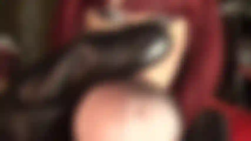 Cock feeder - along with her tasty big cock mistress pushes her leather finger into your mouth.