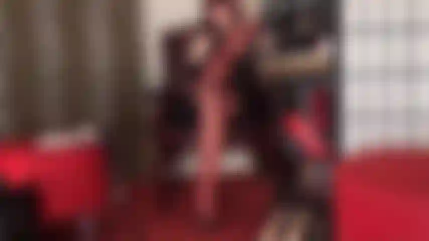 Pantyhose seduction in glossy red nylon layers and leather high heel mules.