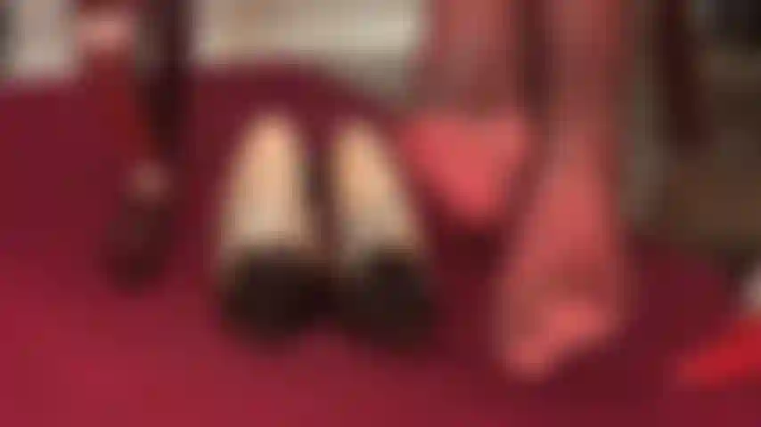 Foot worship in layers of super glossy red and gray nylon layers - so close you can almost taste them.