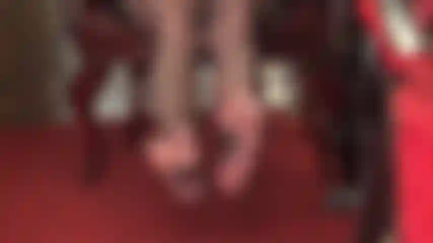 Sexy nylon feet in seamed black pantyhose are twirling as your foot goddess exploits your foot fetish.