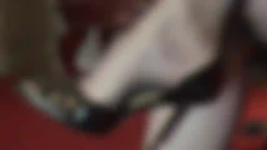 Foot worship, shoe play in seamed black pantyhose and shiny black stiletto pumps.