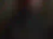 Glove fetish - dressed in shiny black vinyl, mistress takes on shoulder length black leather gloves.