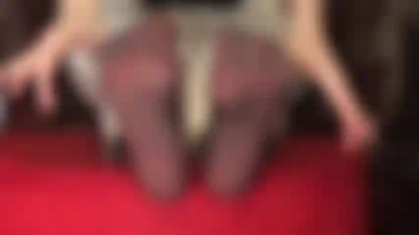 White jeans and sheer black nylon soles - sexy pantyhose feet are wiggling out of white jeans.