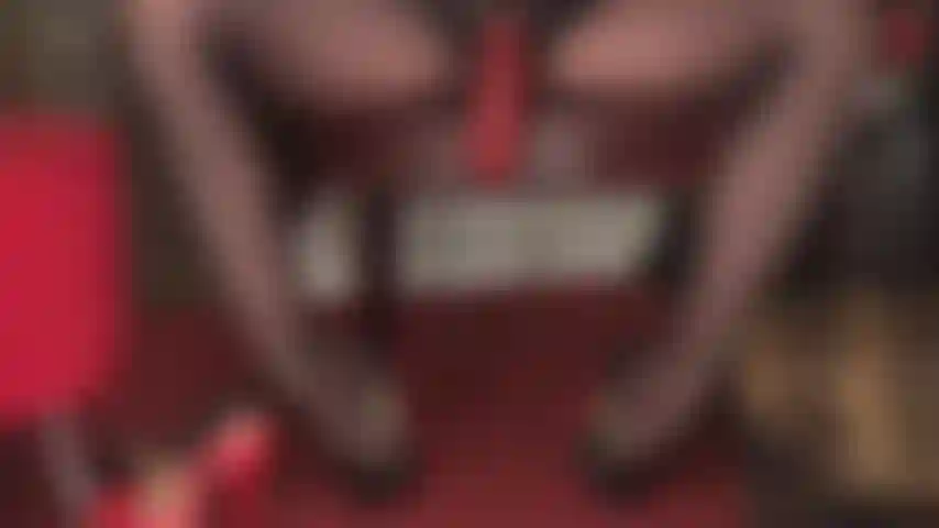 The big red - mistress' thick red cock nestled between her shiny pantyhose legs certainly gets your attention. Worship mistress' cock under the desk.