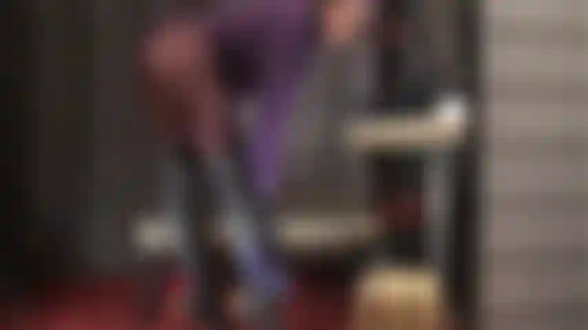 Satin panties are used to polish mistress' wonderful black leather boots.