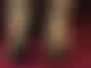 Feet in rubber stockings and strappy open toe sandals.