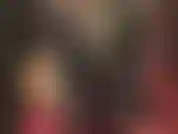 Tight lycra spandex catsuit, leather boots, gloves and long leather coat.