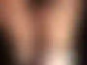 Sexy black satin shorts, glossy pantyhose and satin boots.