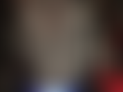 Mistress teases with her curves in hot bodysuit, a pair of vibrant blue satin shorts and tall black shiny boots before teasing cock.