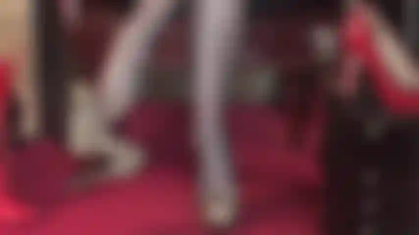 Watch the dangling queen in super sheer black pantyhose and leopard print platform pumps.