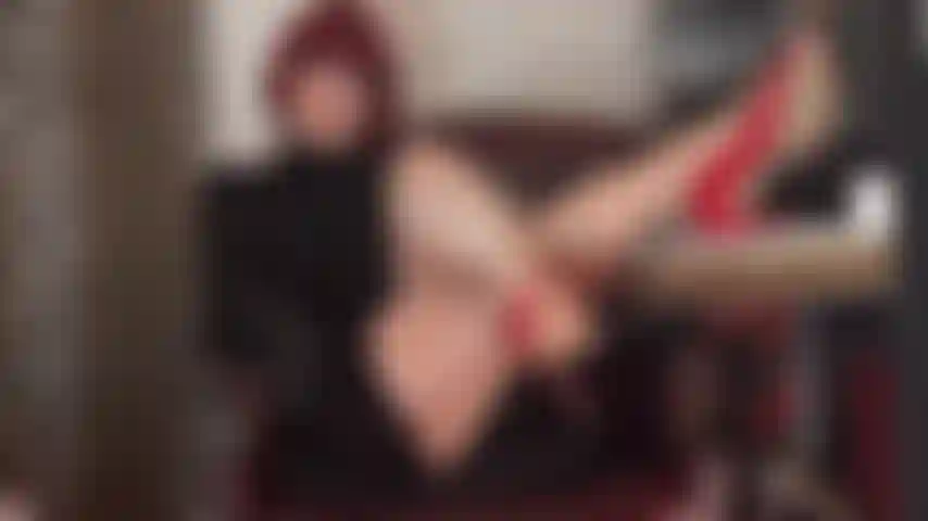 Sexy boss lady has her shiny long pantyhose legs and heels up on her desk.