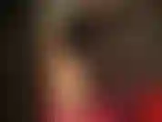 Mistress teases with her fragrant high heels and glossy pantyhose legs, wearing a black sheer nylon mask.