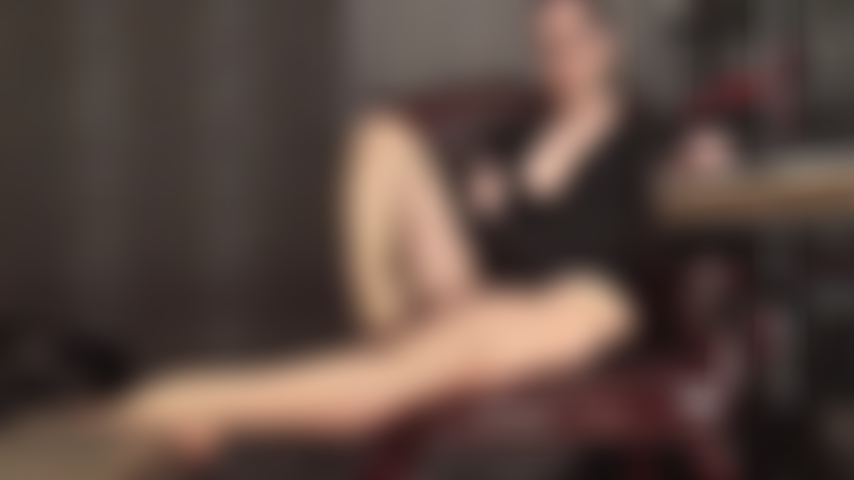 Sensual pantyhose seduction with mistress' hair pulled back.