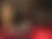 Mistress squats showing off her amazing ass and hips in shiny black pvc thong bodysuit and sheer leopard print pantyhose, teasing cock.