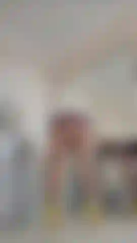 Very short latex dress, pantyhose & boobs tease.