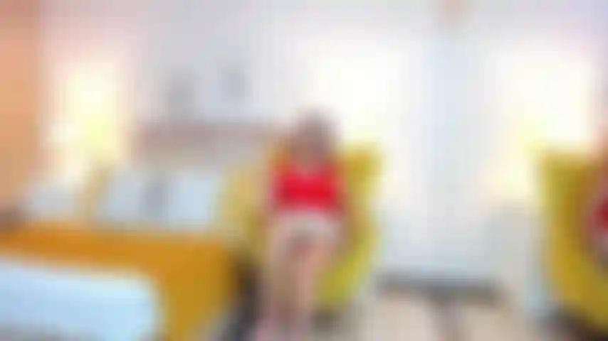 MILF-style eroticism, red heels and mini skirt