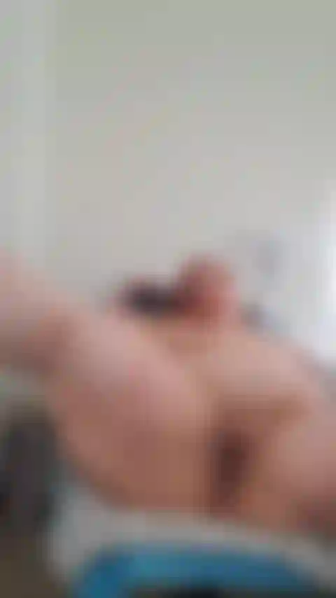 MASTERBATING WITH MY VIBRATOR,  LEGS WIDE OPEN.