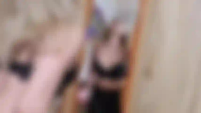 kinky naughty blonde spitting on mirror and playing with spit while wearing leather