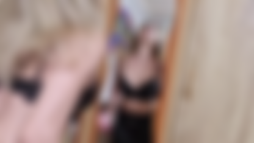 kinky naughty blonde spitting on mirror and playing with spit while wearing leather