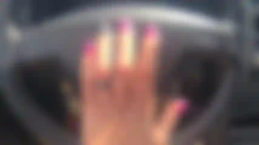 nails tapping on steer wheel