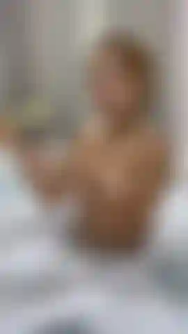 Taking a wet shower with oil on my tits.