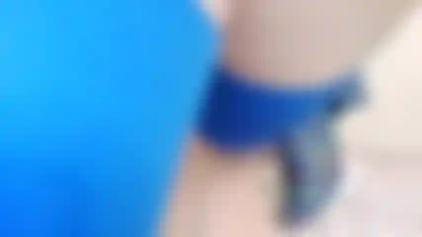 Blue Seams stockings legs up in air, showing ass, fingering pussy, glass dildo.