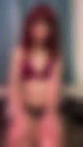 Transgender punk chick shows off feet.