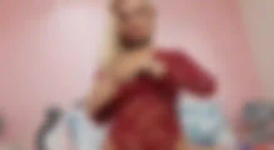 Sucking_my_dildo_in_a_red_outfit_teasing_you_big_tits