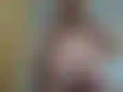 Rubbing oil over my very pregnant belly, while nude.