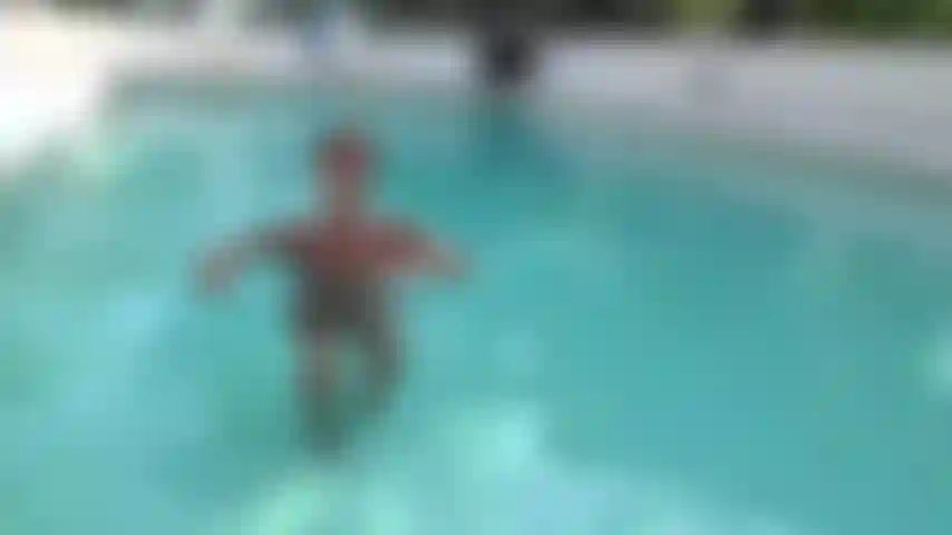 The MILF emerges from the pool.