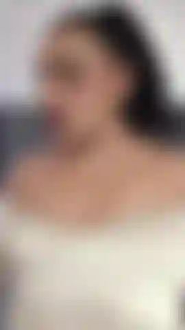 "She pumps the dildo slowly, biting her lip as she gets wetter."