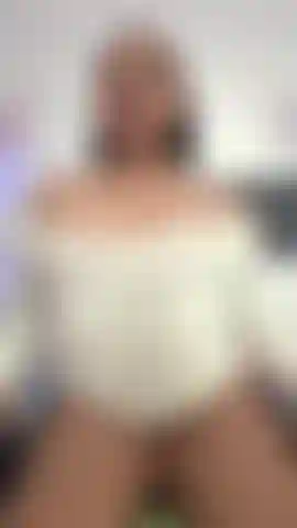 "Her legs shake as she pushes the dildo deep inside herself."