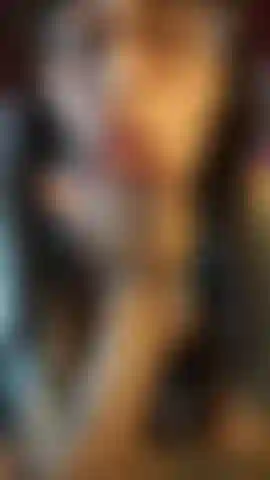 Sexy babe in body dress, fishnet stockings, slapping her ass & showing off her feet.