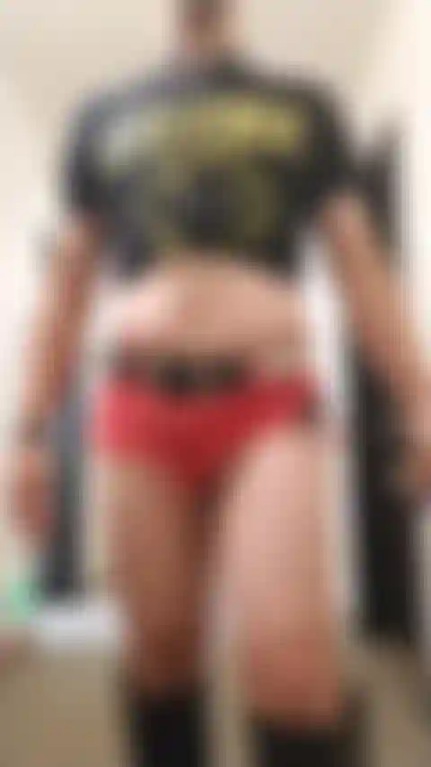 Crossdresser Posing Sexy in Hotel Hallway Wearing Jean Shorts and Boots