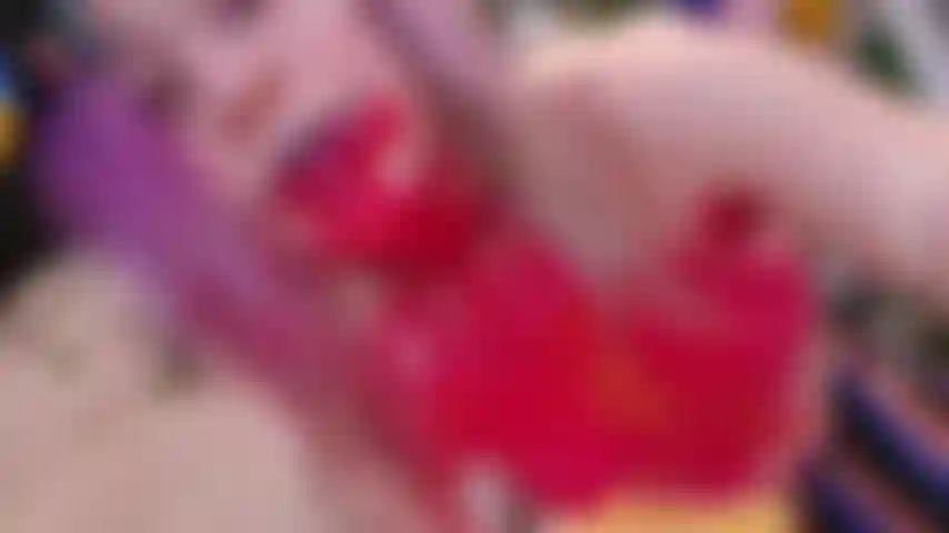 Wanted to paint on some canvases, when I ended up becoming the canvas. 
Spit dripping out of my mouth, with red, yellow paint all over my face, mouth, tongue& boobs