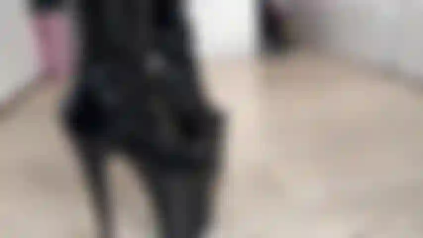 Masked girl in latex with boots