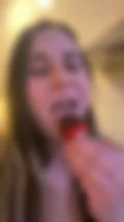 Eating a Chocolate Covered Strawberry
