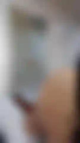 Sucking on the mirror.