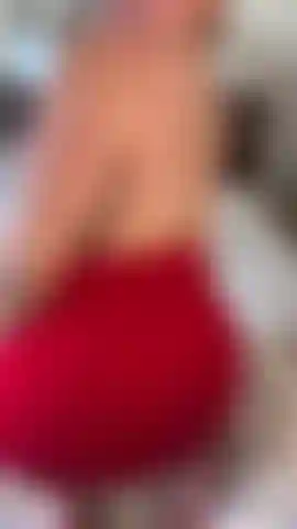 Spreading and spanking ass in red skirt