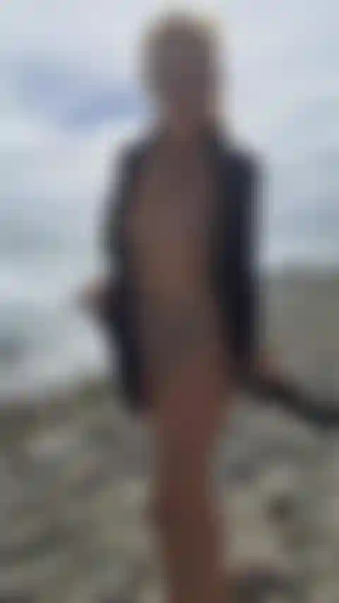 On the beach i pose naked for the camera.